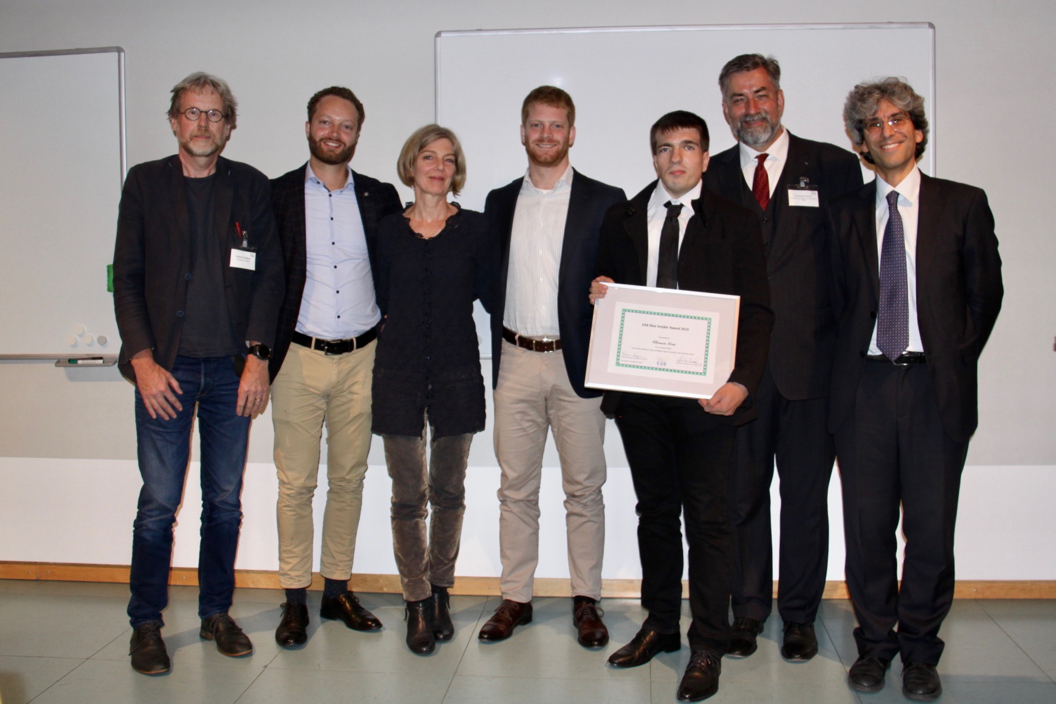 [Photo] Jury member Prof Raymond Veldhuis, Arthur Snijder, Carine Wouters, Caspar Snijder, the award winner Dr Klemen Grm together with the EAB chairman Alexander Nouak and the EAB award chair Prof Patrizio Campisi